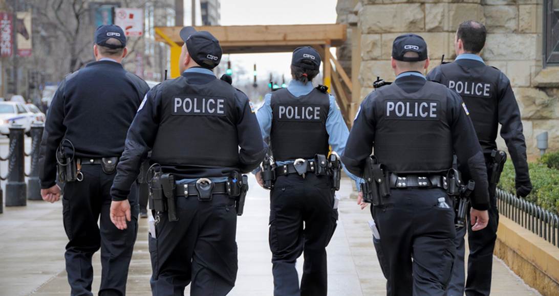 A group of police officers walking
AI-generated content may be incorrect.